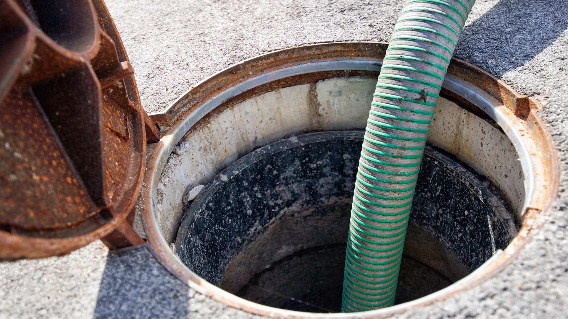 Sewer line cleaning access point during service