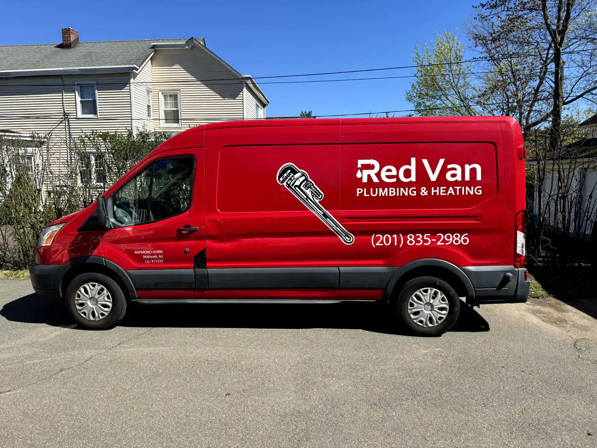 Red Van Plumbing service vehicle