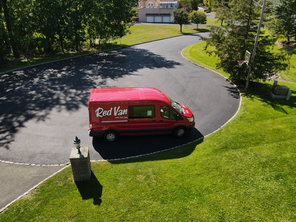 Red Van Plumbing and Heating van in a Bergen County driveway